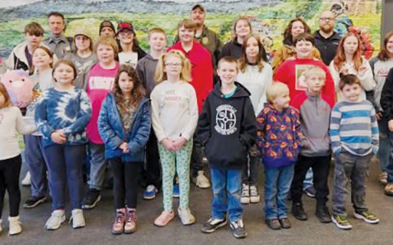 The children who participated in the Graham County Sheriff Office’s “Shop with a Cop” on Dec. 14 gather with law-enforcement officials outside Walmart in Murphy. Photos courtesy of Graham County Sheriff's Office