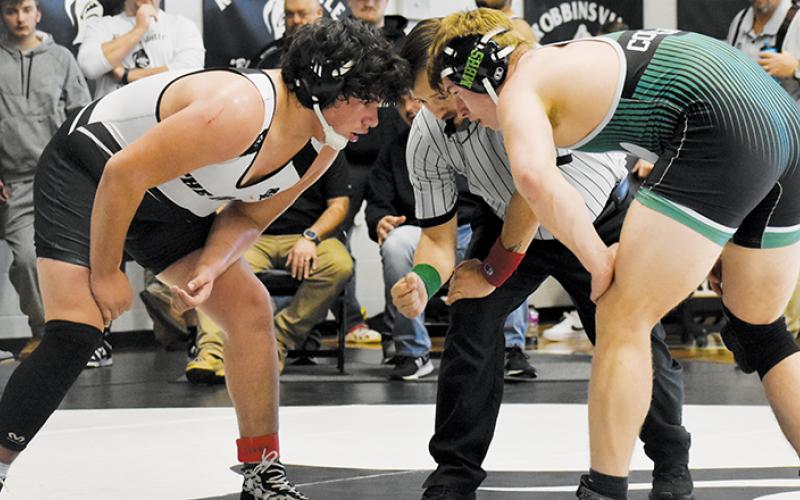 Robbinsville’s Kellen Ensley (215) stares down Mountain Heritage’s Braxton Batchelor at the dawn of overtime in the semifinals of Saturday’s James Orr Invitational. Ensley would soon take a 13-11 decision over Batchelor and was later named the Most Outstanding Boys Wrestler of the tournament. Photo by Audrey Colvin/The Graham Star