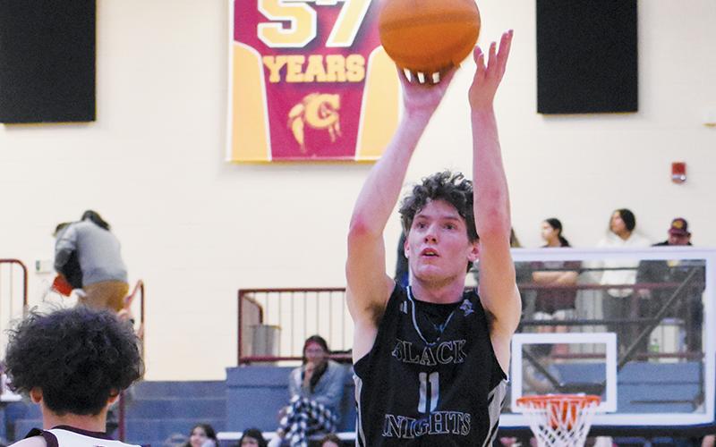 Black Knights senior Donovan Carpenter keys in on a first-half jumper during the regular-season finale Feb. 13 at Cherokee. Photos by Kevin Hensley/sports@grahamstar.com
