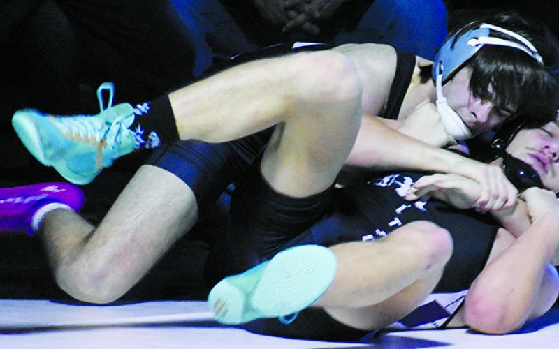 Kyler Branham hooks Mitchell's Jayden Burleson for an eventual near-fall in the second round of the state dual-team tournament Saturday. Branham went on to score the second majority decision for Robbinsville in the match. Photo by Kevin Hensley/sports@grahamstar.com