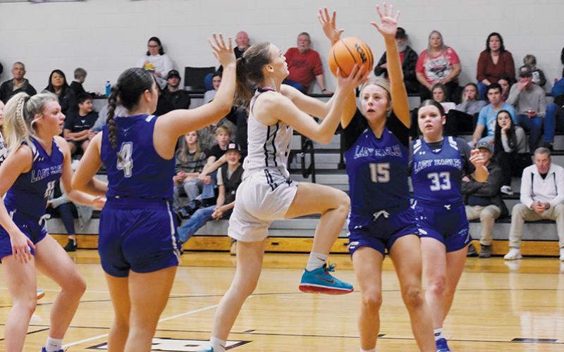 Junior guard Claire Barlow fearlessly drives through four Hiwassee Dam defenders – Katie McNabb, Brinkley Payne, Olivia McNabb and Sky Taylor (from left) – in the second half of Jan. 25’s home game with the Eagles. Photos by Fala Welch/The Graham Star