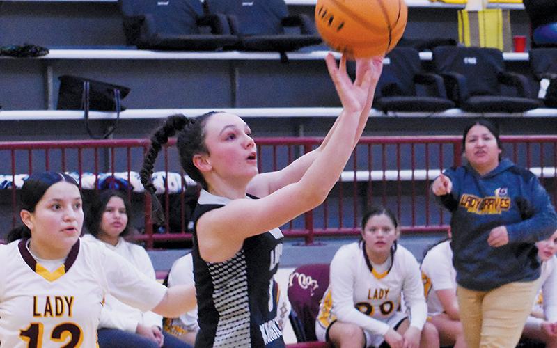 Freshman Chasity Jones goes for a side jumper during Tuesday's JV girls opener at Cherokee. Photo by Kevin Hensley/sports@grahamstar.com