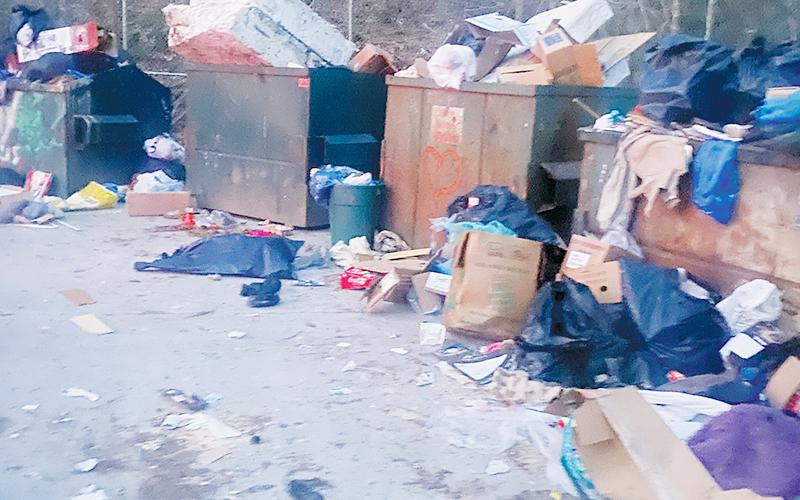 Since reverting back to the former 24-hour convenience of several Graham County sanitation centers, early-morning sights like this one March 11 at the Bear Creek location have become more commonplace.