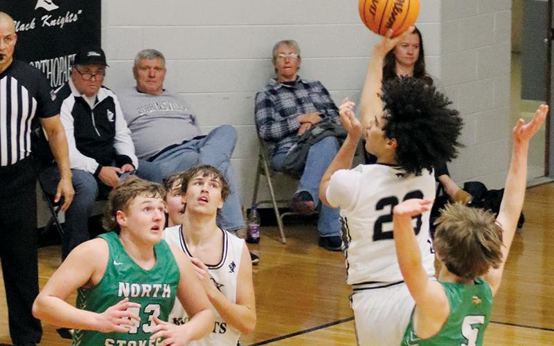 Darion Ledbetter turns to fire a second-half attempt Tuesday against North Stokes. Thanks to the Vikings, Robbinsville’s season came to an early halt in the first round of the state playoffs. Photo courtesy of Crystal White/Robbinsville High School