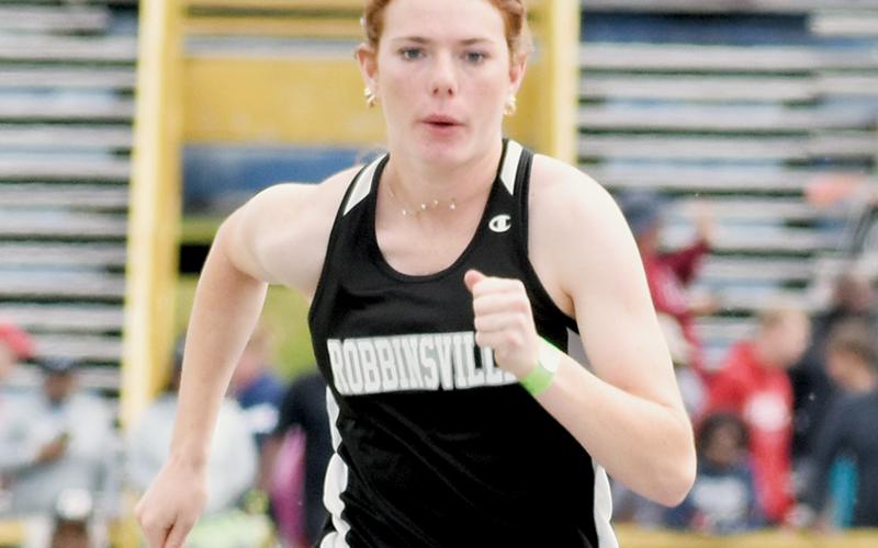 Robbinsville seniors Zoie Shuler and Cuttler Adams – shown competing at last year’s state championship meet – will help usher in the Knights’ 2024 track &amp; field season. As part of their curtain call, both are seeking returns to the 1A dance. Photos by Kevin Hensley/sports@grahamstar.com