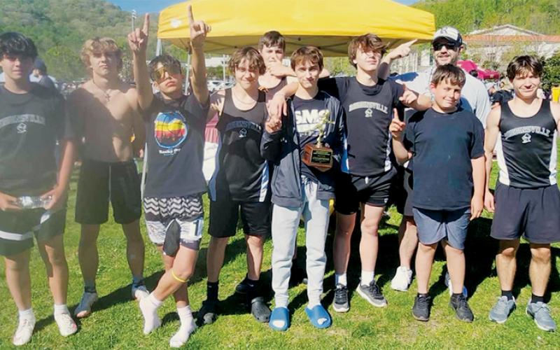 The Robbinsville Middle School Black Knights won the Smoky Mountain Conference track &amp; field championship Monday at Cherokee. From left are Braylon Blevins, Cameron Allison, Xamuel Wachacha, Mason Silvers, Ben Koeller, Eli Lambert, Braydon Lane, head coach Wren Millsaps, Channing Mull and Colton McCoy. Not pictured are Austin Angelo, Ethan Chekeleelee, Kenai Wolfe, Carsan Snider, Kam Woods, Jaxson Blundell, Khayton Swimmer, Braydon Allison and Elijah Kirkland.