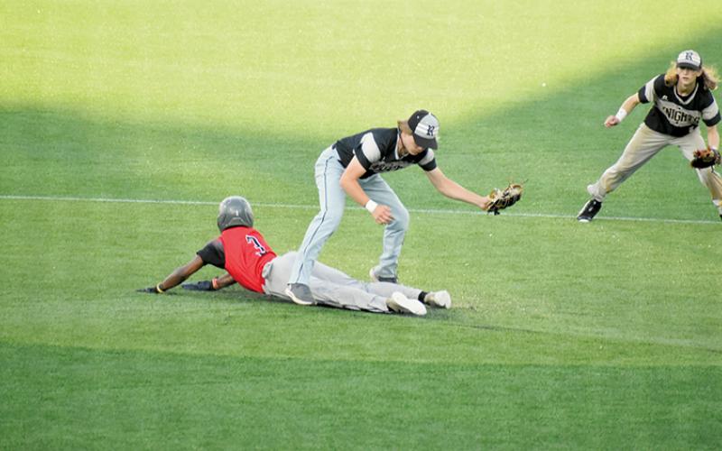 With classmate Bryc Garrison backing him up, Graylen Orr watches Thomasville sophomore Mkyel Duncan slide underneath for an attempted stolen base during the first round of the playoffs May 8. Both teams were unaccustomed to playing on an artificial infield, so Duncan overshot the bag and Orr tagged him out moments later. Photos by Kevin Hensley/sports@grahamstar.com