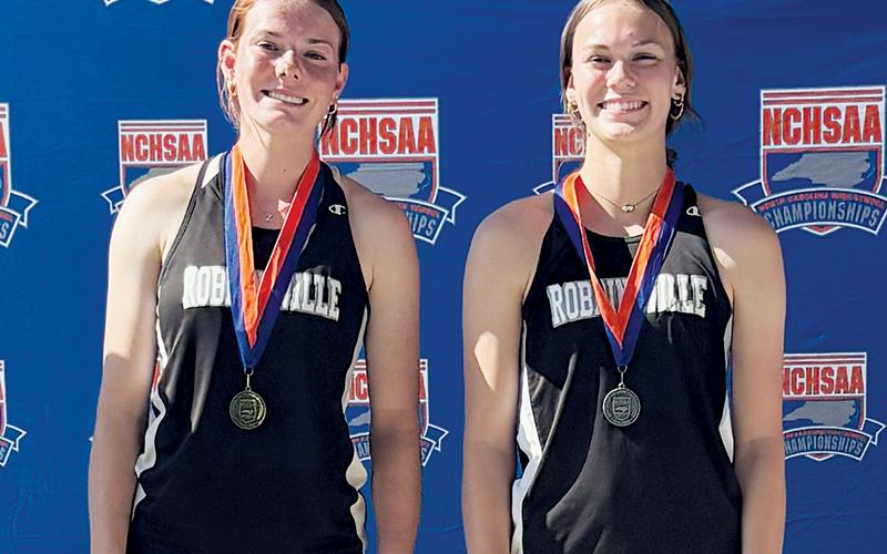 Lady Knights teammates Zoie Shuler (left) and Claire Barlow took the top two spots on the awards podium in the triple jump competition at Monday’s state championship meet. The happenstance was just one of many that left Robbinsville in high spirits at the conclusion of the gathering. Photo courtesy of Kylie Shuler
