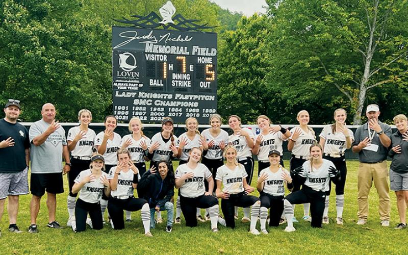 After clinching a trip to the Elite 8 on Monday, the Lady Knights gathered in right field to celebrate the moment. Photo by Kevin Hensley/sports@grahamstar.com