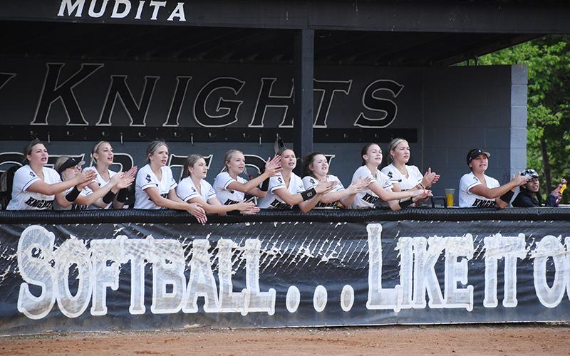 Members of the Robbinsville Lady Knights root on the team during May 10's second-round playoff game against Murphy. From left are Dreylee Webster, Ella Atwell, Anna Williams, Payton Odom, Ella McGuire, Sydney Adams, Delaney Brooms, Olivia Lewis, Claire Barlow, Liz Carpenter, Naomi Taylor and manager Ruthie Aguirre. Photo by Jacquline Gayosso/The Graham Star