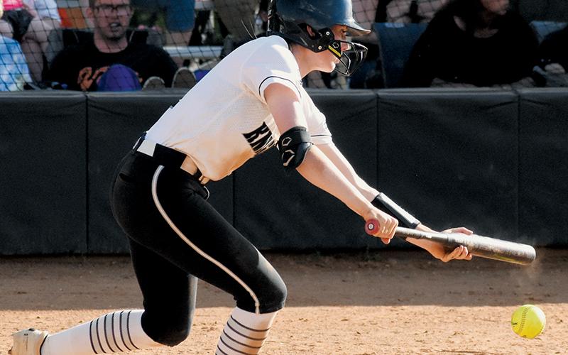 Zoie Shuler drops a bunt during May 2’s regular-season finale against Murphy. Along with resetting two school records this year, the senior’s propensity to reach base  allowed her to surpass the state record for runs scored in a single season Monday. Photos by Jacquline Gayosso/The Graham Star