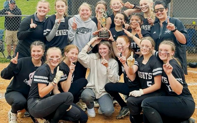 The Robbinsville Middle School Lady Knights capped an unblemished 13-0 season by downing Cherokee 16-5 on Monday to win the conference title game. All names are listed from left. Front row: Bella Coats, Khaygen Buchanan, Loxley Burke, Daphne Barlow, Kynadee Spencer, Lexie Williams and Zeyli Williams. Back row:  Assistant coach Lauren Silvers, Natalee Myers, Mylee Webster, Lakin Orr, Alyssa Bohn, Ella Nelms, Jayden Chekeleelee, Myah Winfrey and head coach Anna Stewart.