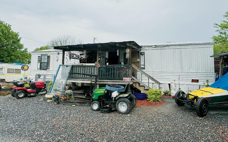 Graham County authorities raided this residence on Ward Street in Robbinsville on May 3 and uncovered a plethora of evidence. Two suspects were arrested. Photo by Kevin Hensley/editor@grahamstar.com