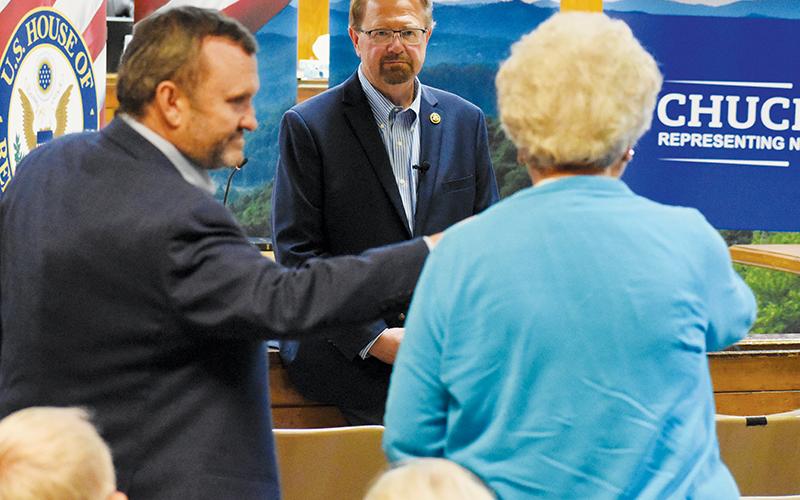 Rep. Chuck Edwards listens intently while a member of the audience shares her concerns over the closing of Cable Cove Campground during Edwards’ town hall visit June 20. Photos by Kevin Hensley/editor@grahamstar.com
