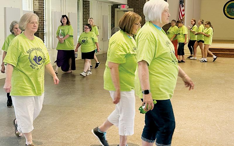 With temperatures Monday afternoon in the 90s, participants in this year’s Elder Abuse Awareness Walk called an audible and made laps around the Graham County Community Building’s meeting room, where a corresponding fair had just wrapped up hours earlier. Photo by Latresa Phillips/The Graham Star