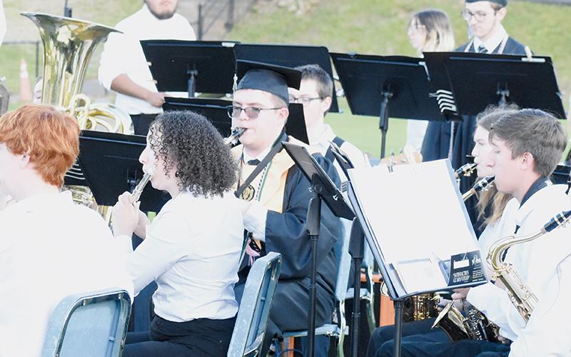 Seniors Aidan Holder (front) and Drake Hyde (both in caps and gowns) joined the Robbinsville band for one final performance during Friday’s ceremony, as the Black Knights entertained the masses with  “Novena.” Holder will be attending Appalachian State University in the fall; Hyde is enrolling at Western Carolina University.