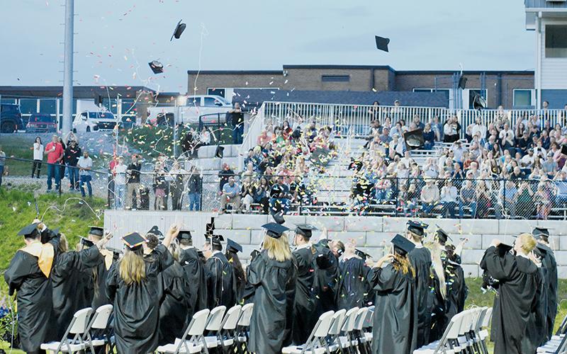 Caps, confetti, and Silly String began to litter the evening sky Friday, as the Robbinsville High School Class of 2024 launched a celebration at the end of the annual commencement exercise on Bob Colvin Field at Modeal Walsh Memorial (Big Oaks) Stadium. Photos by Kevin Hensley/editor@grahamstar.com
