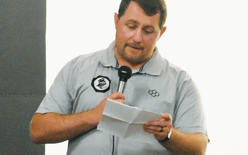 Colby White speaks at the June 5 Robbinsville High School wrestling state championship ring ceremony. The Graham County alum has been appointed the new head coach of the Black Knights’ powerhouse varsity grappling program. Photo by Kevin Hensley/sports@grahamstar.com