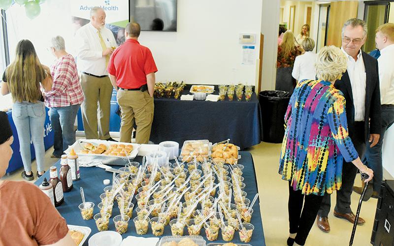 There was barely any room to navigate the front lobby of AdventHealth’s urgent care facility in Robbinsville, with plenty of interested parties stopping in to meet the new provider, as well as enjoy fellowship and food.
