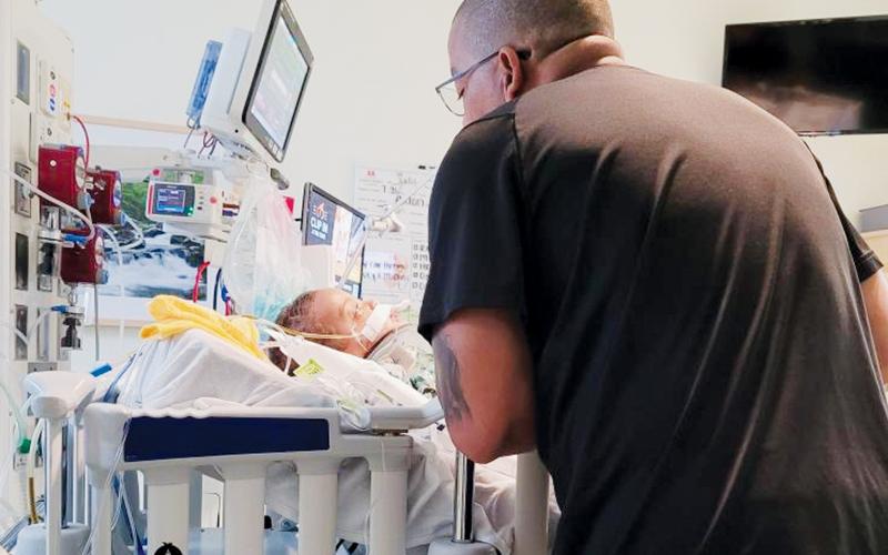 Rarely did a moment pass when parents Josh (pictured) and Becca Reap were not pinned to Axton’s side,  providing words of encouragement for an understandably-frightened toddler.