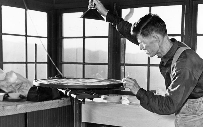 Ferd Colvin in the Hemlock Fire Lookout, c. 1930. Photo courtesy of Pam Hall Mathews/Charles Hall Museum and Heritage Center