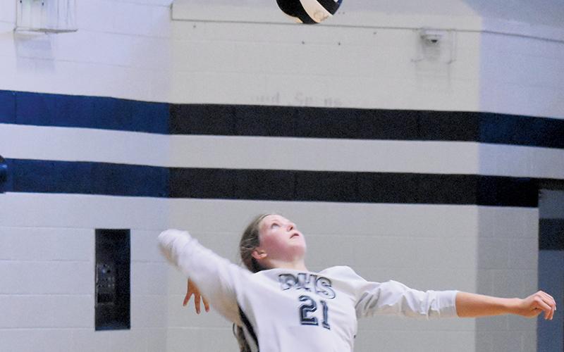Zaelyn Phillips eyes a service attempt during Tuesday’s JV match against Murphy. Photo by Kevin Hensley/sports@grahamstar.com