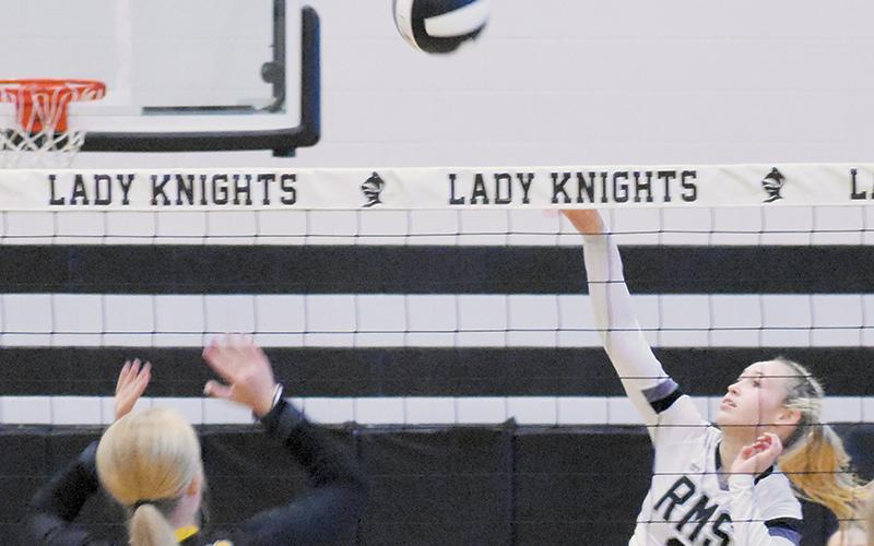 Myah Winfrey spikes the ball back into Murphy territory during Tuesday’s middle school season opener. Photo by Kevin Hensley/sports@grahamstar.com