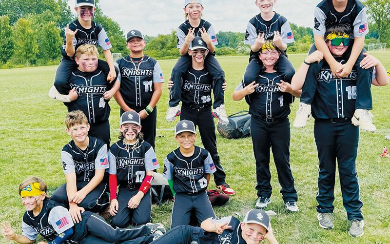 The 10U Robbinsville Black Knights were able to enjoy the week of a lifetime in August, traveling to Ohio to  compete in the inaugural Savannah Bananas Ball Youth Tournament. All names are listed from left in each row. Laying in front: Dake Haney and Jacob Emmons. Kneeling: Jax Mullinax, Jameson Baxter and Baylor Nichols. Standing: A.J. Farr, Canyan Gross, Kyson Carpenter, Kasen Garrison and Levi Millsaps. On shoulders: Lawton Gibby, Daylon Anderson, Brayden Menard and Eli Nelms.