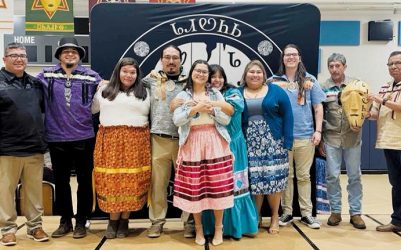 Cherokee County/Snowbird Tribal Council Rep. Adam Wachacha (far left) and Roger Smoker (far right) gather around the six latest graduates of the Dadiwonisi Language Program, all of whom were recognized at a Monday ceremony. In-between Wachacha and Smoker (from left) are language  instructor Cassidy Galaviz, Callie Bush, Malakai Littlejohn, Lauryn Rattler, Rachel Ballou, Lakoda Bird, Troy Jones and Mike Wachacha. Photo courtesy of April Johnson/Contributing Photographer