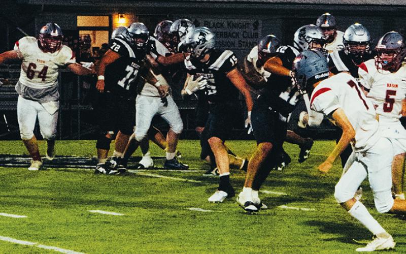 Roman Jones (15) works through the front-line battle Sept. 12 against Copper Basin. Jones eclipsed the 250-yard mark and recorded all four of Robbinsville’s touchdowns at Trion, Ga. Photo by Royce Worbington/The Graham Star