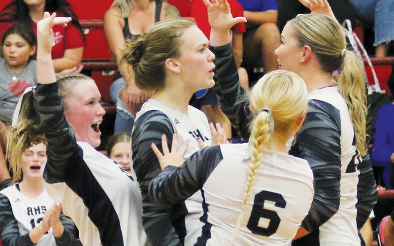 The Robbinsville Lady Knights celebrate after winning a hard-fought volley Aug. 29 at Andrews. Visible are Daphne Barlow (left), Claire Barlow, Suri Watty (6) and Liz Carpenter. Photo by Cannon Crompton/Cherokee Scout