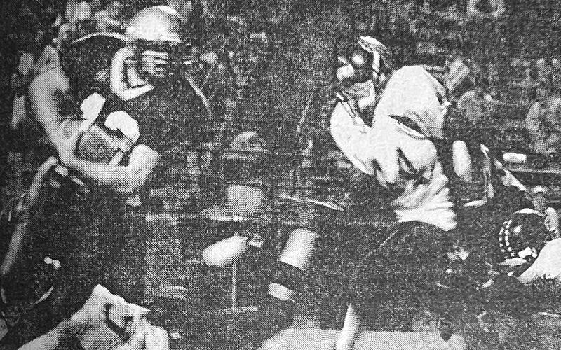 In this photo from the Halloween 2002 edition of The Graham Star, Zach “Bear” Chekeleelee (44) charges at a Hayesville runner.