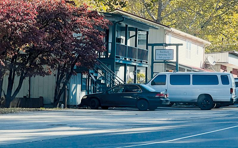 The bodies of two men were found deceased inside a second-floor apartment attached to this business Monday. Photo by Kevin Hensley/editor@grahamstar.com