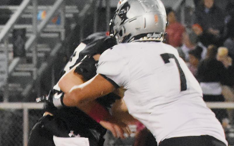Isiac Collins traps Andrews quarterback Everett Tatham for 1-of-4 Robbinsville sacks Friday. Photo by Cheyanne Geyer/The Graham Star