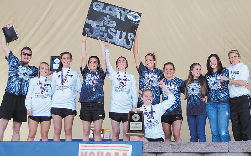 The 2009 Robbinsville Lady Knights cross country team remain the only female  program in school history to win a state championship. From left are head coach Rance Shuler, Tacey Trammell, Kristi Burchfield, Madison Williams, Chantal Collins, Lynsey Crisp, Faith Trammell (kneeling in front), Lauren Griggs, Lindy Cronk, Kelsey Knight and assistant coach Joanne Knight. Not pictured are Dixie Hedrick and Tianna Williams.