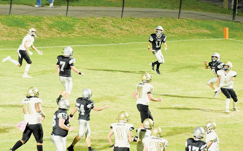 Braylon Blevins (17) watches for Eli Lambert (11) to catch a two-point conversion pass in JV action Monday against Hayesville. Lambert completed the exchange, to round out the Black Knights’ 30-12 win. Photo by Jacquline Gayosso/The Graham Star