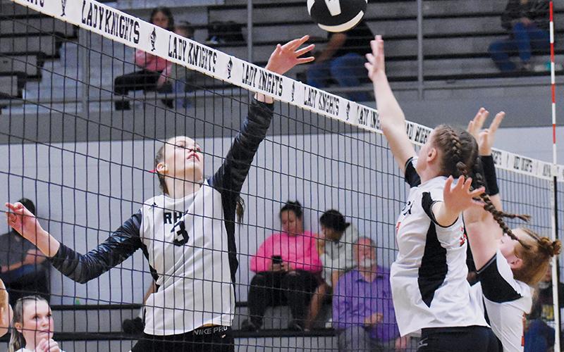 Senior middle hitter Claire Barlow – who led the 1A West in kills (338) before Tuesday’s playoff match – pulls some chicanery to slip the ball past Rosman’s Lilly Orr and Lillie Dodson. Robbinsville advanced to the second round of the postseason after besting its former conference rival in four sets. Photos by Jacquline Gayosso/The Graham Star
