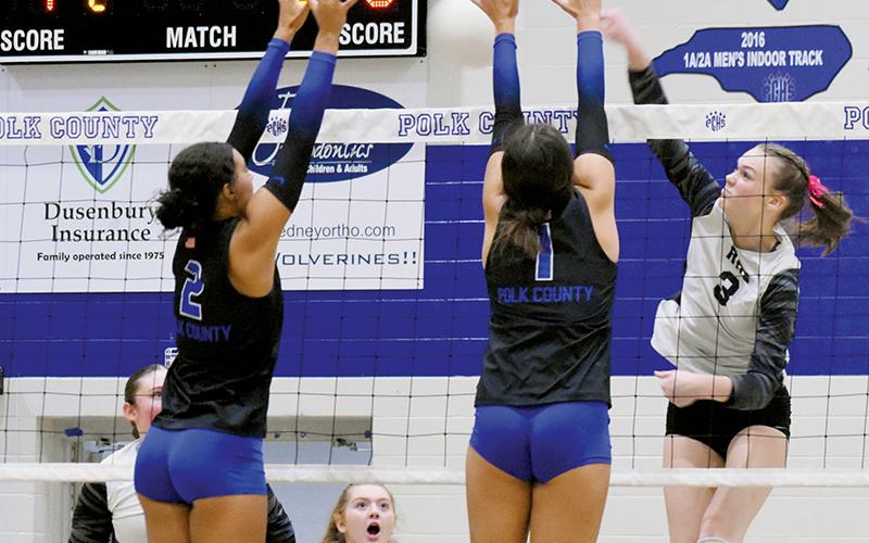 Robbinsville’s three volleyball seniors played their final game as a Lady Knight on Oct. 24, in the second round of the state playoffs. Claire Barlow spikes the ball between Polk County’s Sophia Overholt (2) and Morgan Yoder. Photos by Kevin Hensley/sports@grahamstar.com