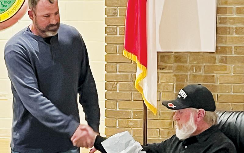 Graham County Board of Commissioners Chairman Jacob Nelms (left) shakes hands with departing  commissioner Keith Eller on Tuesday. Eller did not seek re-election, which made Tuesday his final meeting. Photo by Kevin Hensley/editor@grahamstar.com