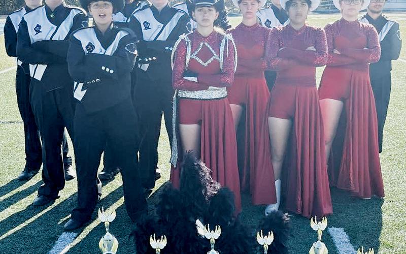 Members of the Robbinsville Black Knights Band pose with the hardware collected at Nov. 2’s Land of the Sky Marching Band Festival, which was held at Enka High School. All names are listed from left in each row. Front row: Rosie Orr, Myley Hyde and Sarai Cervantes. Second row: Jaden Boyle, Sharea Kirkman, Melissa Drouin and  Emily Boyle. Back row: J.T. Hyde, Evan Hood, Dreydon Conley, Murphy Shanahan and Wade Rogers. Photo courtesy of Robbinsville High School Band