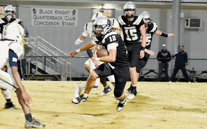 Quinn Jumper (12) eyes a T.C. Roberson defender as he cuts upfield Friday. Photos by Cheyanne Geyer/The Graham Star