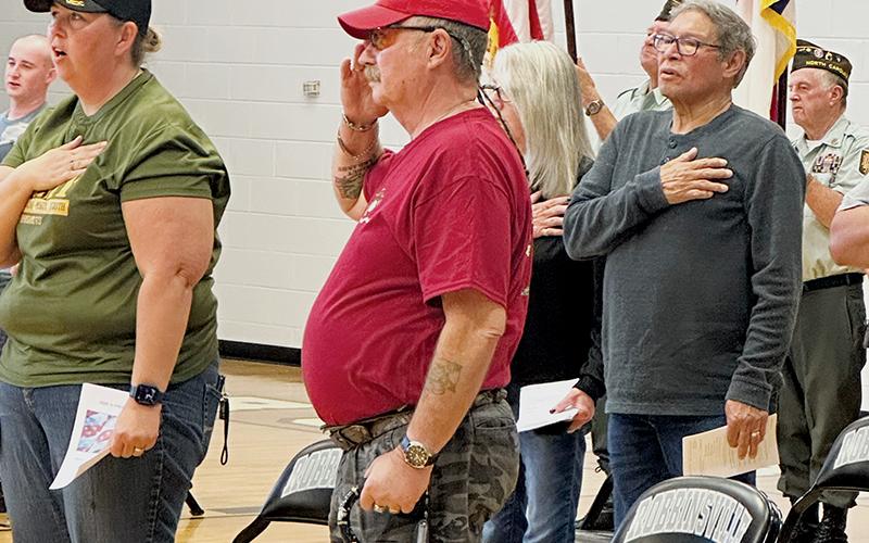 Amanda Gyongyos and Jim Huffman (front row), plus David Crowe and Sharon Crowe (back) stand to sing The Star-Spangled Banner at Friday’s Robbinsville High School Veterans’ Day program. Photos by Latresa Phillips/The Graham Star