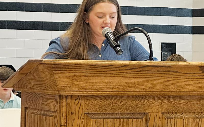 Senior Olivia Lewis speaks during Friday’s Veterans Day tribute at Robbinsville High School.