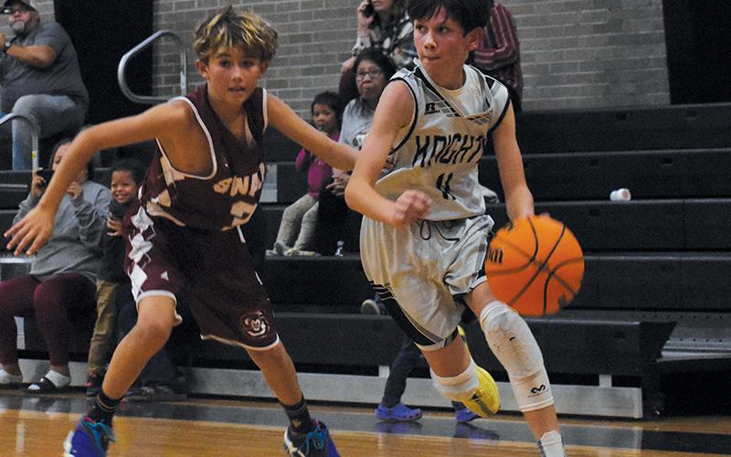Robbinsville Middle School’s Carsan Snider cuts toward the paint during Nov. 4’s season opener against Swain.
