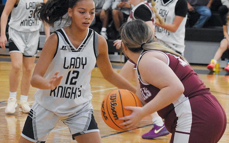 Robbinsville’s Aaliyah Wolfe keeps a watchful eye on a Swain County player during Nov. 4’s season opener.