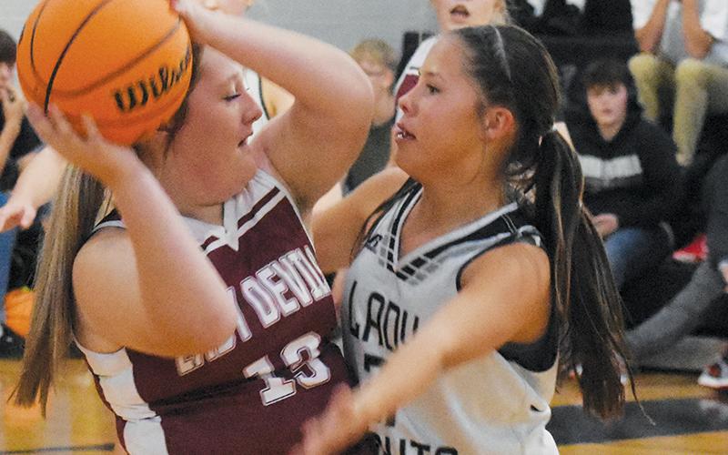 Hazeleigh Driver (right) traps a Swain County ball handler during Monday’s lopsided victory over the Lady Devils. Photo by Cheyanne Geyer/The Graham Star