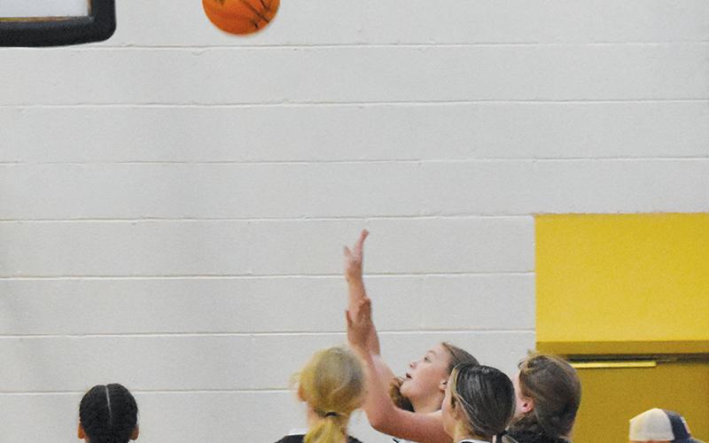 Robbinsville’s Lakin Orr (14) puts up an inside shot during Nov. 21’s home game against Andrews. Photo courtesy of Kyla Garland/Contributing Photographer