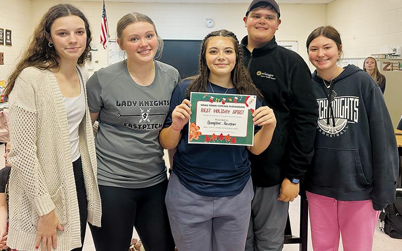 The teams formed for Nov. 14’s inaugural “Smalltown Cupcake Showdown” flexed their creative muscle, both over a stove and when selecting a name for their ensemble. Pictured are the “Gangster Grinches,” which are comprised of (from left): Alexis Miller, Zeyli Williams, Alyssa Bohn, Dreydon Conley and Bella Coats. Photo by Latresa Phillips/The Graham Star