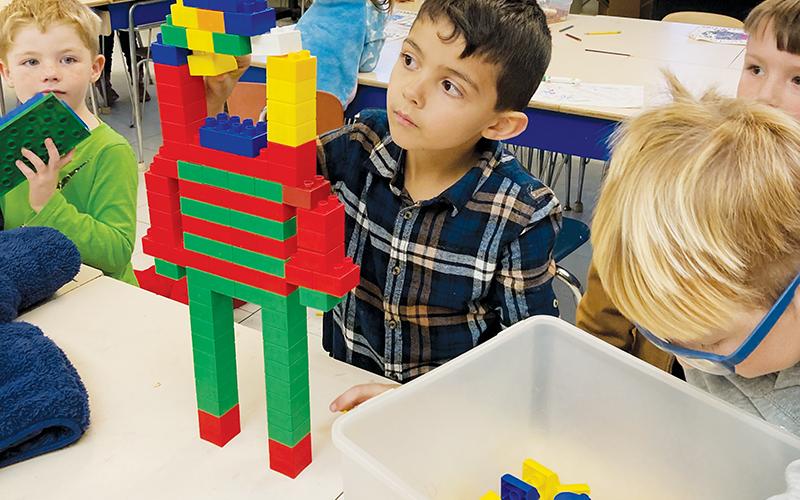 Kindergartners Braxton Clark, Jack Portal, Hunter Gonzalez and Axel Orr (from left) work with Legos as part of STEAM activities at Robbinsville Elementary School. Photo by Dusty Orr/Robbinsville Elementary School