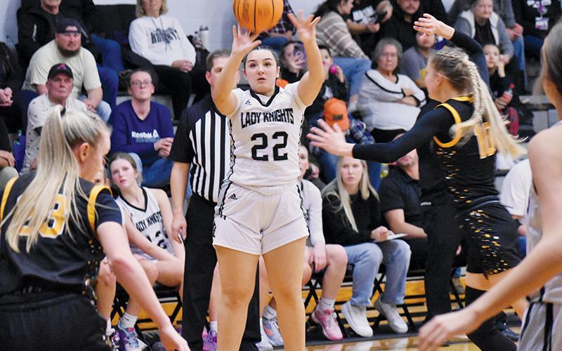 Taking advantage of a frantic scramble inside the paint, Robbinsville senior Jozlyn Garland unloads a 3-pointer Friday against Murphy. Photo by Kyla Garland/The Graham Star